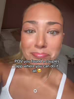 A selfie style cover image shows a young woman looking towards the camera, with a slight smile and her eyes looking as though she is holding back tears. Text overlayed reads "POV you found a couples app where you can do it all" and emoji.
