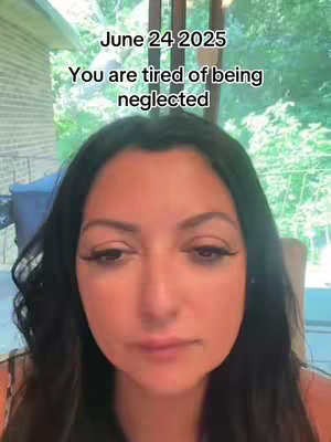 A selfie-style video cover image showing a woman's face with a slightly downcast expression. The background includes glimpses of what appears to be an outdoor setting, adding a layer of depth. Text overlays at the top deliver an information about the time and date, with a sentence conveying the video's message.