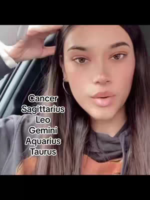 A young woman with long brown hair is shown from the chest up, positioned in what appears to be a car. Text overlays list zodiac signs. The woman is looking directly at the camera with a neutral expression.