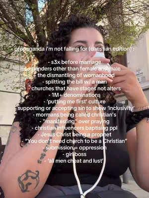 A selfie-style shot against a backdrop of a building and trees. The person is holding an object near their face. Overlayed on the image is a list of statements with a white font.