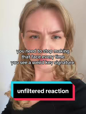 A woman with blonde hair and fair skin is centered in the frame, looking directly at the camera with a slightly furrowed brow and a concerned expression. The background is a plain, neutral white. Overlaid text includes a statement and a call to action. She's wearing a black top.
