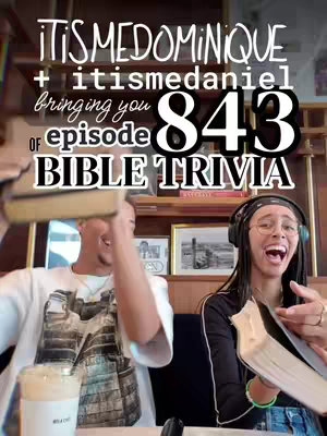 The image is an eye-level shot showcasing two people holding open books, likely Bibles, while smiling widely. The person on the left is a person on the left is light-skinned with black hair and a white t-shirt; a coffee cup. The person on the right is a person with glasses and dreadlocks, wearing a black top. The background includes elements of an indoor setting with a wooden cabinet, pictures, and decorations on shelves. Overlaid text in a stacked format reads, "ITISMEDOMINIQUE", "+ itismedaniel", bringing you", "843", "of episode", "BIBLE TRIVIA", using a bold white font and black outlines.