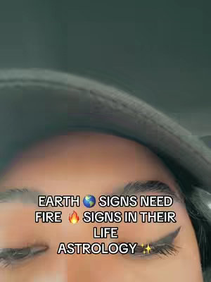 A close-up shot of a person's eyes and a portion of their face. The image has text overlaid on it. The background is a dark, muted color, and the person has dark eyeliner applied.