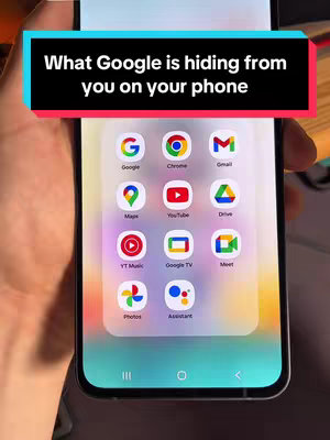 The cover image shows a person's hand holding a smartphone displaying the home screen with various Google apps. Above the phone screen is a black bar with white text. The background is slightly blurred, focusing on the phone's screen and the user's hand.