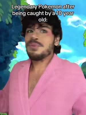 A person with dark hair and a neatly trimmed beard is centered in the frame, wearing a pink collared shirt. The background consists of a vibrant, cartoonish landscape with green and blue hues.