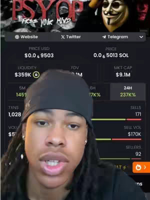 A man with dark hair and a black beanie is centered in the frame. Behind him, a website interface displays cryptocurrency data. Overlayed on the top are the words 'PSYOP' with additional text 'FREE YOUR MIND'.