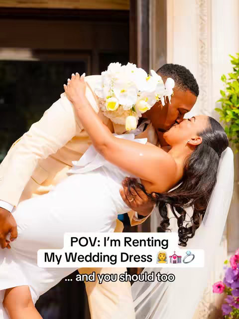 A couple kissing in front of a building with a romantic feel. The bride is wearing a white dress and holding a bouquet, while the groom wears a cream-colored suit, both in embrace. Text overlaid at the bottom.