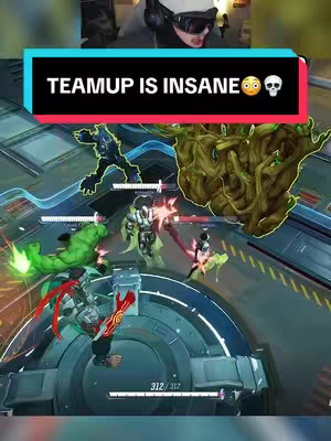 A dynamic action shot from a video game shows multiple characters engaged in combat, with a player's face overlaid in the top portion of the frame. A colored banner with white text indicating that teamup has been great.  The game's environment is futuristic, with metallic surfaces and neon lighting. The action is intense, indicated by particle effects. The overall composition emphasizes the action.