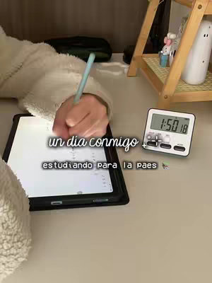 The cover image shows a person's hand holding a pen over a tablet, presumably taking notes. The tablet is on a desk with a digital timer. Text overlays are placed on the image.