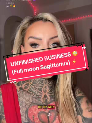 A close-up shot of a woman with blonde hair and heavy makeup. She has tattoos and a red top. A red banner with white text covers the lower part of her face and upper chest. The background is blurred, showing a room with a hint of lighting.