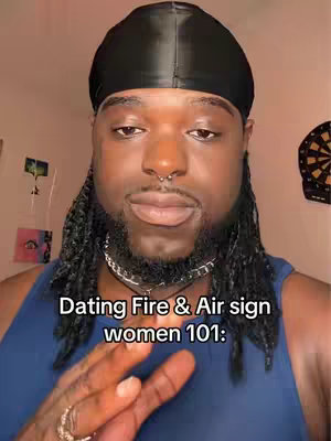 A close-up shot of a Black man wearing a black durag and a sleeveless blue shirt. He has dreadlocks and a nose ring. Text overlays the image at the bottom.