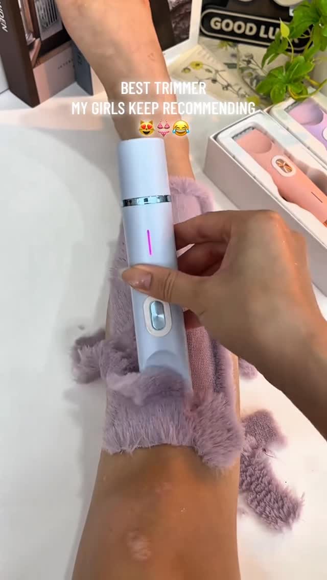 A person is holding a white electric grooming device over their arm. The arm has a fluffy purple sleeve protector on it. The text overlay offers recommendations.