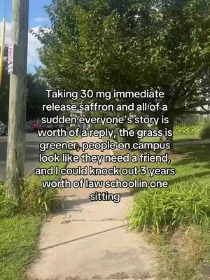 The image shows a sidewalk with grass and trees on either side. Text is overlaid on the image.