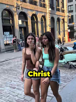 Two young women walk side by side on a cobblestone street. The building in the background has arched windows and a light tan color. One woman wears a brown tank top, and the other wears a teal top. The word "Christ" is overlaid on the image in a yellow-outlined black rectangle.