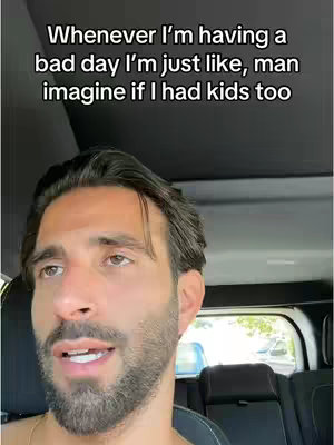 The cover image is a selfie-style shot featuring a man inside a car. The man has dark hair, a beard, and is looking to his left, with his mouth slightly open as if speaking. The text overlayed on the top states "Whenever I'm having a bad day I'm just like, man imagine if I had kids too". The lighting is natural, and the overall composition is conversational.