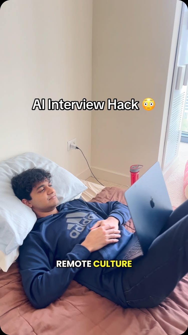 The cover image shows a young man lying on a bed with a laptop resting on his legs. Text overlays indicate the topic is about an AI interview hack. The man is wearing a blue hoodie and appears relaxed.