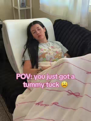 A woman is lying in bed, appearing to be resting. She is covered by a blanket and has text overlaid on the image. The color palette is soft, with a focus on neutral tones and pink accents.