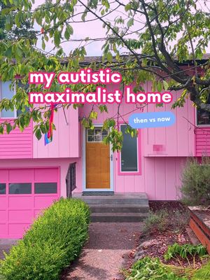 A vibrant pink house with a gold door, green foliage, and overlaid text. The two-story house is entirely painted pink, including the garage door. A tree with green leaves frames the top of the house. Text overlays read, 'my autistic maximalist home' and 'then vs now'.