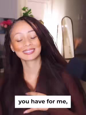 The cover image features a woman with long, dark hair and softly applied makeup. She is looking down with closed eyes and a slight smile, appearing peaceful. The background is blurred, but suggests a domestic setting, with hints of light and shadow adding depth to the image. A text overlay appears in a white box at the bottom of the image.