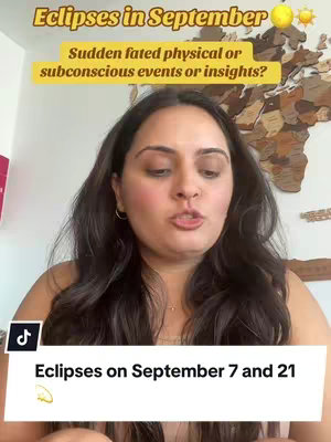 A woman with brown hair is centered in a vertical video frame, speaking directly to the camera. She's wearing a neutral-colored top and has a necklace. Behind her, a neutral-colored wall features a world map made of wood, providing a warm backdrop. Overlaying the image are text elements at the top and bottom. The top text, in a bold, yellow font, reads "Eclipses in September" with a sun and moon graphic besides the text. Below this, additional text poses a question about sudden events or insights. At the bottom, a white banner with the TikTok logo displays "Eclipses on September 7 and 21". The image is brightly lit, creating a friendly and informative tone.