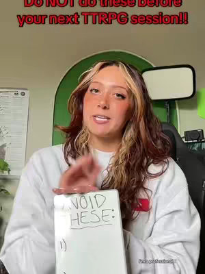 A woman with light brown hair, highlighting, and makeup is holding a white board with the words "AVOID THESE:" written on it. The background features a green arch, a whiteboard, and a studio light.