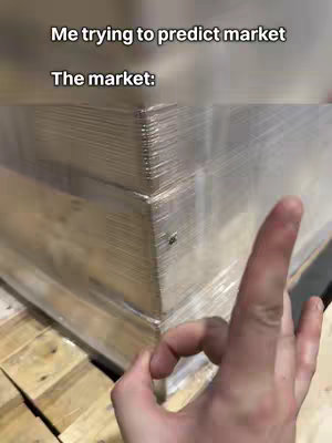 The cover image features a close-up of a hand making the 'OK' gesture in front of a large, rectangular package wrapped in clear plastic. The package partially obscures the background, though some pale wooden planks are visible at the bottom. Text overlays are present at the top, indicating the video's theme and context.