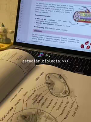 The cover image shows an open book on a table with a laptop behind it. The book is open, displaying a diagram of a cell, and the laptop is displaying text. The text overlayed on the picture reads: “estudiar biología >>>”,. The color palette is neutral with some brighter images on the laptop screen.