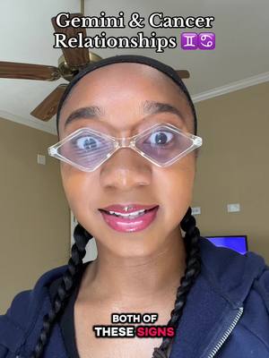 A selfie of a smiling woman with diamond-shaped clear glasses, braided pigtails, and a hoodie. Text overlays read 'Gemini & Cancer Relationships' and 'BOTH OF THESE SIGNS'. The background is a neutral-toned room.