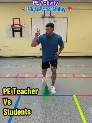 The image shows a man in a gym-like setting, wearing a blue shirt, black shorts, and white shoes. He is mid-stride, seemingly approaching the camera. On the floor, there is a line marked with red and yellow tape, in addition to a green cone. Text overlays at the top read, 'PE Activity Ping Pong Relay' and at the bottom, 'PE Teacher Vs Students'.