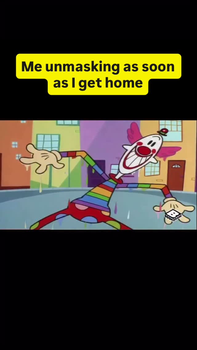 The image shows an animated clown character, appearing to be in a state of relief or excitement after leaving a building. The clown is depicted in a rainbow-colored outfit. It is set against the backdrop of a colorful neighborhood with buildings visible in the background. The text overlayed on the image states "Me unmasking as soon as I get home".