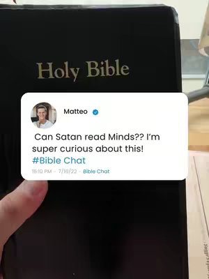 The image presents a close-up view of a black "Holy Bible" with gold lettering, held by a hand. A white rectangular overlay features a profile picture of Matteo with a blue checkmark, alongside text asking, "Can Satan read Minds?? I'm super curious about this!" with the hashtag "#Bible Chat" and a timestamp. The background is blurred, with hints of additional text visible at the bottom.