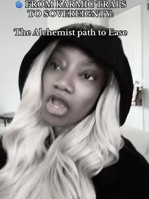 A monochrome image of a woman's face, angled slightly to the left. She's wearing a black hooded sweatshirt, and dramatic blonde waves frame her face. Text overlays on the upper portion present information.