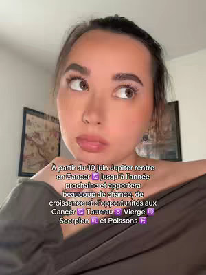 The cover image features a young woman with brown eyes and dark hair looking up and to the right, with a slight smile. She is wearing a dark top, and the background includes parts of a room and text overlayed in white and purple.