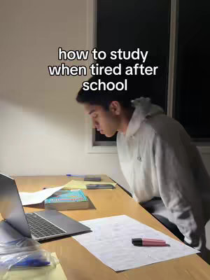 The cover image shows a young man studying at a desk. He is leaning over the desk, and his face is turned slightly to the side, suggesting concentration. There is a laptop, papers, and a textbook on the desk. The background is dimly lit, with a window visible.