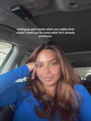 A woman is sitting in a car, her head resting on her hand. Text is superimposed on the image.