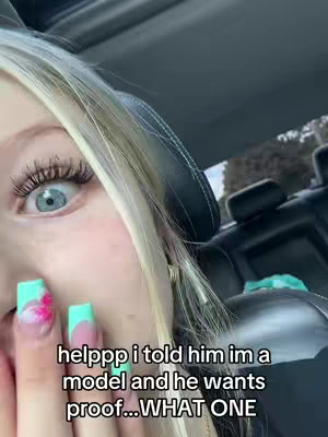 A close-up shot features a young woman with long blonde hair and a portion of her face visible, including her right eye and hand. The eye is wide open, with defined eyelashes and blue iris, making it stand out. Her hand is positioned in front, displaying turquoise-tipped nails with a floral design on the pinky, the nails are also decorated. Additionally, there is text overlayed on the bottom of the image.