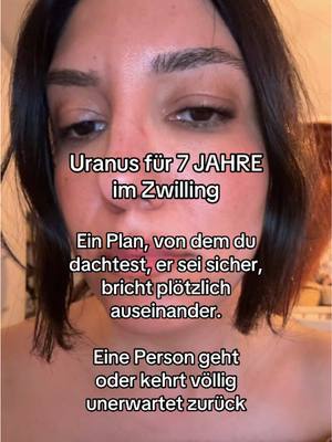 A close-up shot of a person's face, angled to show most of the face. The background is slightly out of focus with warm tones. Overlayed text in white letters is present on the image.