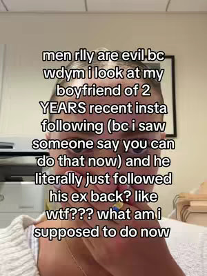 A selfie-style video cover image showing a person holding their hand up to their face, covering their mouth and conveying distress. Text overlayed on the image details a relationship issue.