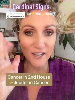 A woman with blonde curly hair is speaking to the camera. Text overlays include "Cardinal Signs" at the top and "Cancer in 2nd House Jupiter in Cancer" in a lower section. The background includes a partially visible shelf and wall art.