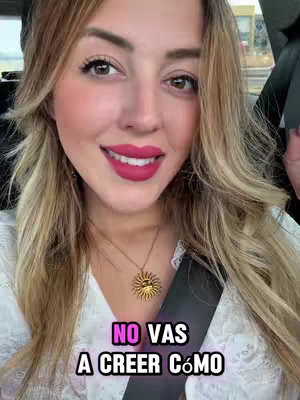 A vertical video cover image features a smiling woman in a car, taking a selfie. She has long blonde hair, bright red lipstick, and a gold necklace. The background shows the outside of the car, and in front of the woman is a text hook in a pink and white bubble overlaying the image.