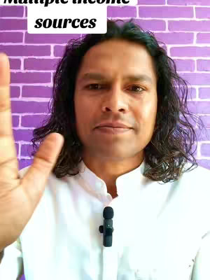 A medium shot features a man with long, dark hair against a purple brick wall background. Above him at the top of the frame is white text that says "Multiple income sources". He is wearing a white shirt and holding his hand up, partially obscuring his face. A small black microphone is clipped on his shirt.