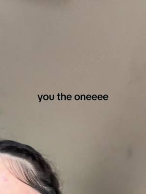 A selfie-style shot featuring the top of a person's head and the upper portion of their face, with text overlayed on a plain background.