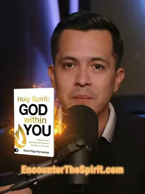 A man sits in front of a microphone. To his left is a book titled "Holy Spirit: God Within You". The book is white with gold accents. The background is a blurry mix of purple and gold.
