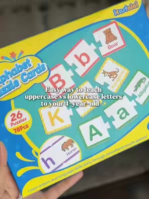 The cover image shows a colorful educational puzzle with alphabet letters and images. The puzzle pieces show capital and lowercase letters with corresponding illustrations. Text overlays the image informing about how to learn uppercase vs lowercase letters.
