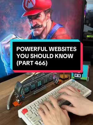 The cover image shows a scene with a computer monitor displaying a digital artwork of what appears to be a muscular and stern-looking Mario. A black and blue overlay with white text reading "POWERFUL WEBSITES YOU SHOULD KNOW (PART 466)" is placed in the foreground. The hands of a person are shown typing on a white keyboard in front of a table. Also, other elements are present, like little toys over the table and a mechanical keyboard.