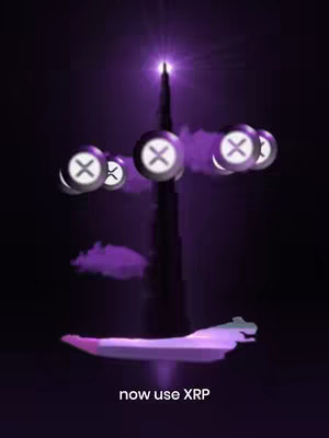 A digitally created image featuring a dark purple background and an illustration of a tall, silhouetted building, possibly representing a landmark like the Burj Khalifa.  XRP symbols are depicted floating around it, with a light emanating from the top. Near the base, a stylized landscape is shown. Text at the bottom reads "now use XRP". The overall composition suggests cryptocurrency and real estate.