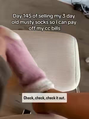 The image shows a person's leg and foot, with a leg in a pink, fuzzy sock and the other bare foot. There is text overlaying the image.