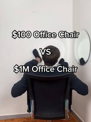 A man sits in an office chair with his back to the viewer, with his feet resting on a white wall. Text overlays indicate a comparison between a $100 and a $1M office chair.