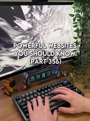The cover image showcases a desktop setup with a prominent monitor displaying an abstract white and gray design. In the foreground, a black mechanical keyboard is being typed on by a person whose hands are visible. Various small decorative items like robots and a digital display are near the keyboard. The background includes greenery. Text overlayed at the top describes the video's subject.