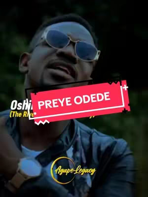 The image features a man wearing sunglasses and a black jacket, set against a blurred background. A red banner with white text overlays his face, and the 'Agape Legacy' logo is visible at the bottom. The overall composition is vertically framed.